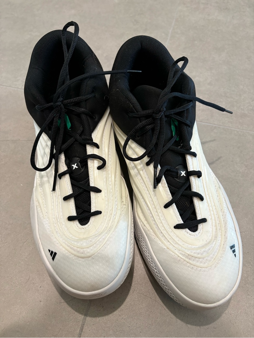 Adidas’s Black and White/Cream Size 12 man basketball shoes